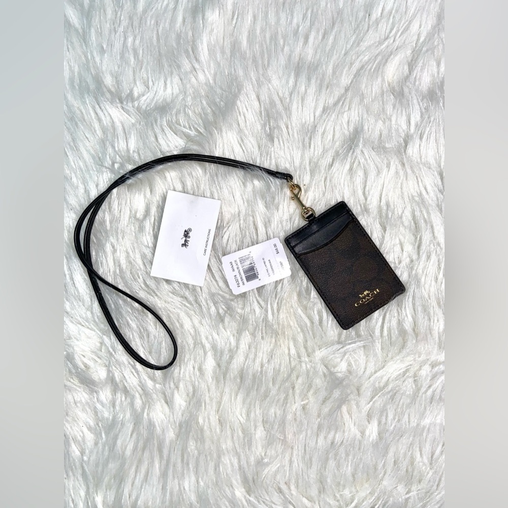 New with tags Coach travel card carrier